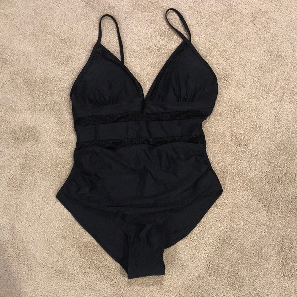 Brand new, never worn. Women’s one piece swimsuit